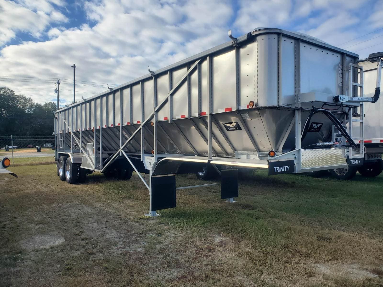 2027 Trinity 42x96 Tandem Axle Stainless Steel Belt Trailer - Air Ride, Fixed Axle